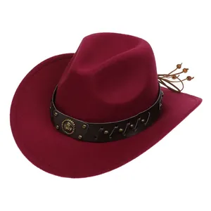Detail of wine red felt cowboy hat with leather band, studs, and braided rope decor