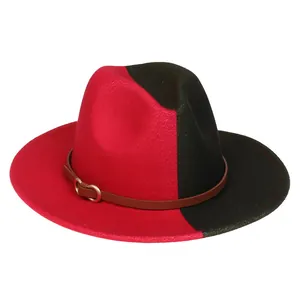 Détail d'un chapeau fedora bicolore rouge et noir avec ruban cuir marron et boucle dorée