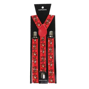Detail of red Christmas suspenders featuring festive elk and snowflake patterns with metal clips