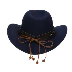 Detail of navy felt cowboy hat with brown leather band, metal studs and wooden beads