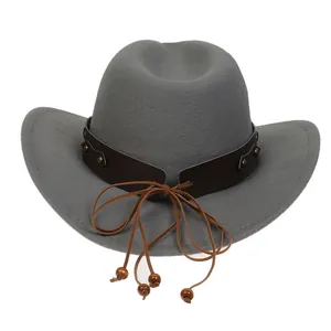 Detail view of gray felt cowboy hat featuring bronze rivets and wooden beads on leather band