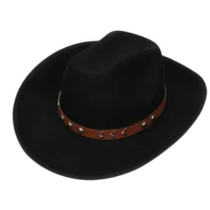 Detail of black wool cowboy hat with brown leather band and silver metal studs