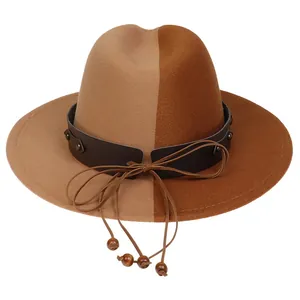 Detail of two-tone wool fedora with leather rivet band and wooden bead trim