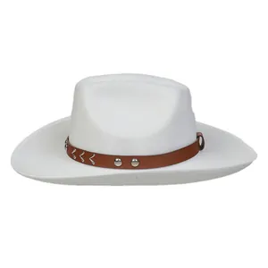 Close-up of white felt cowboy hat with brown leather band and silver metal studs