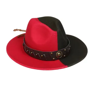 Detail of red and black felt fedora hat with studded leather band and metal emblem