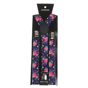 Detailed close-up of floral suspenders with sturdy metal clips and leather joint on card