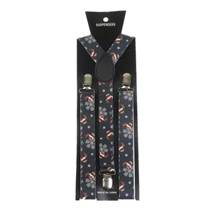 Detail of Christmas themed suspenders featuring reindeer and snowflake holiday patterns