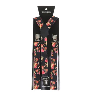 Detailed view of floral pattern elastic suspenders with silver metal clips on card