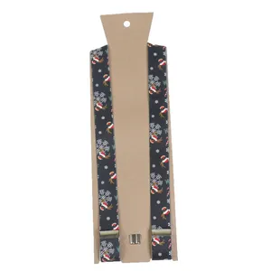 Detail of Christmas reindeer and snowflake patterns on elastic suspenders with metal clips