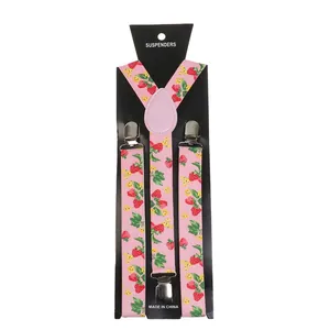 Detail of pink strawberry print suspenders with metal clips and display card