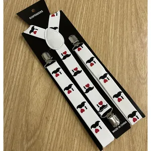 Close-up of elastic suspenders with heart and mustache print and silver metal clips