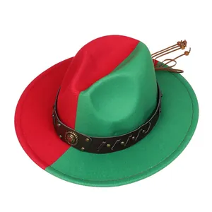 Detail of red and green fedora hat featuring a lion crest emblem and gold studded leather band