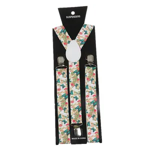 Detail of floral butterfly print suspenders with silver clips and white leather joiner