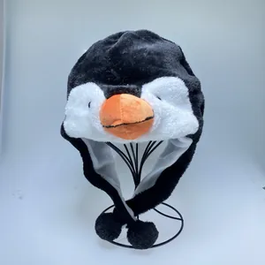 Cartoon penguin plush hat for kids and adults with ear flaps and black pom-poms