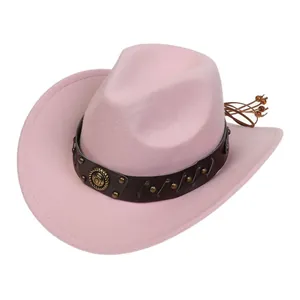 Detail of pink felt cowboy hat featuring vintage leather band with metallic ornaments