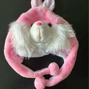 Plush rabbit hat for kids and adults with long bunny ears and pink pompom ties