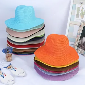 Close-up of colorful summer straw hats showing fine woven textures and vibrant beach style