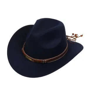Detail of navy felt cowboy hat featuring ethnic brown band with a golden feather buckle