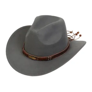 Detailed close-up of a grey felt cowboy hat featuring gold feather and beaded trim