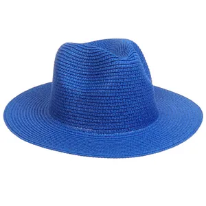 Detailed texture of vibrant blue woven straw fedora hat with sun protection brim