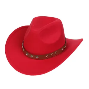 Detail of red cowboy hat with studded leather band and decorative metal arrow accents