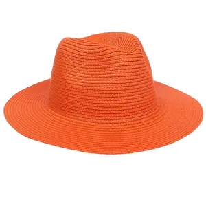 Detailed weave pattern and crown design of this bright orange straw Panama sun hat