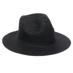 Close-up of the intricate texture on a black woven paper straw wide-brim Panama fedora hat