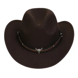 Detailed view of brown felt cowboy hat with silver bull skull emblem and rivets