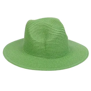 Detailed close-up of the fine woven texture on a grass green Panama sun hat