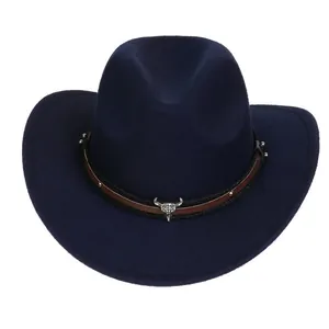 Detail of dark blue western cowboy hat featuring silver bull skull and metal studs