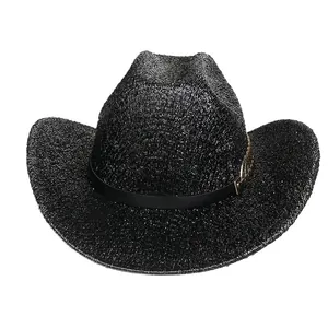 Close-up of black sparkly cowboy hat with textured glitter finish and buckled leather band