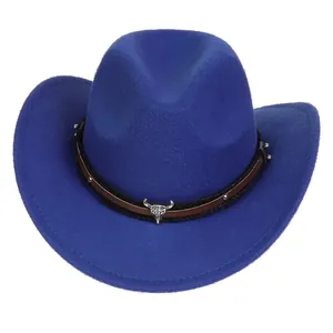 Detailed close-up of blue felt cowboy hat featuring silver bull skull and metal studs