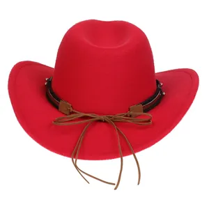 Detail of red wool felt cowboy hat with black studded band and brown tassel accents