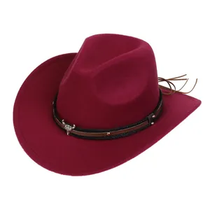 Detailed view of dark red wool cowboy hat with bull head ornament and braided band