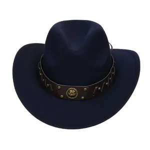 Macro detail of dark blue felt cowboy hat with leather band and gold rivet accents