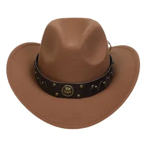 Detail of western brown felt hat featuring leather band with metallic studs and horseshoe emblem