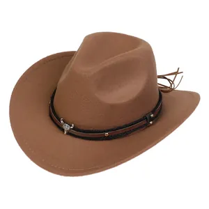 Detail of kids brown felt cowboy hat with silver bull head emblem and metal rivets
