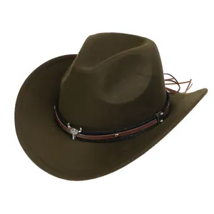 Detail of dark felt cowboy hat featuring metallic bull head emblem and leather strap