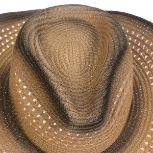 Detailed close-up of brown woven straw cowboy hat with vintage blackened gradient effect