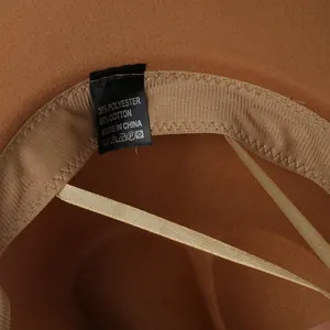 Detail of inner sweatband and fabric care label for a brown wide brim wool cowboy hat