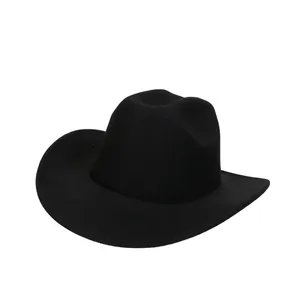 Detail of classic black wool felt cowboy hat with wide brim and structured crown