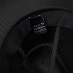 Detail of polyester jazz hat interior featuring washing label and inner sweatband