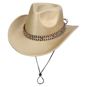 Close-up of golden western cowboy hat with metallic coating and ethnic woven band
