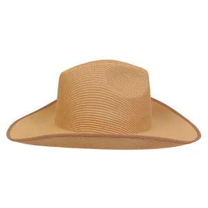 Macro shot of khaki woven straw sun hat detailing wide brim and fine craftsmanship