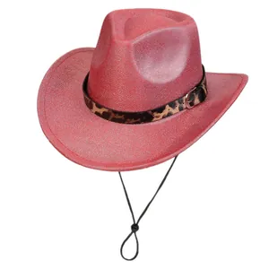 Close-up of red glitter cowboy hat with leopard print band and adjustable chin strap