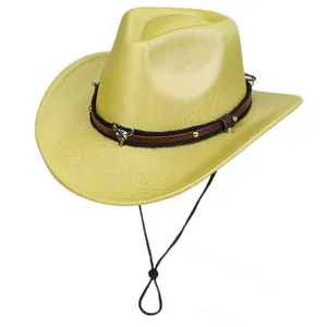 Detail of western cowboy hat with golden glitter finish and silver bull head ornament