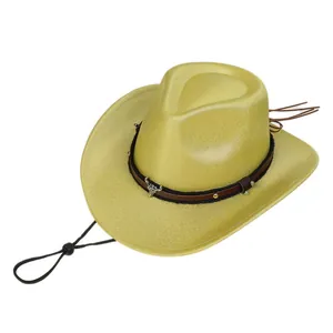 Macro detail of sparkly sequins and metallic bull head emblem on a yellow cowboy hat