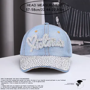 Detail of light blue denim baseball cap with rhinestone heart patterns and 57-58cm size