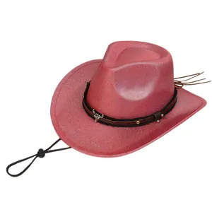 Detail of red cowboy hat with silver bull head buckle and black studded leather band