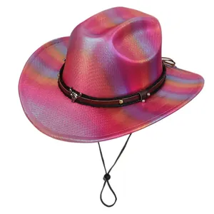 Detail of holographic pink disco cowboy hat featuring a silver bull head metal ornament